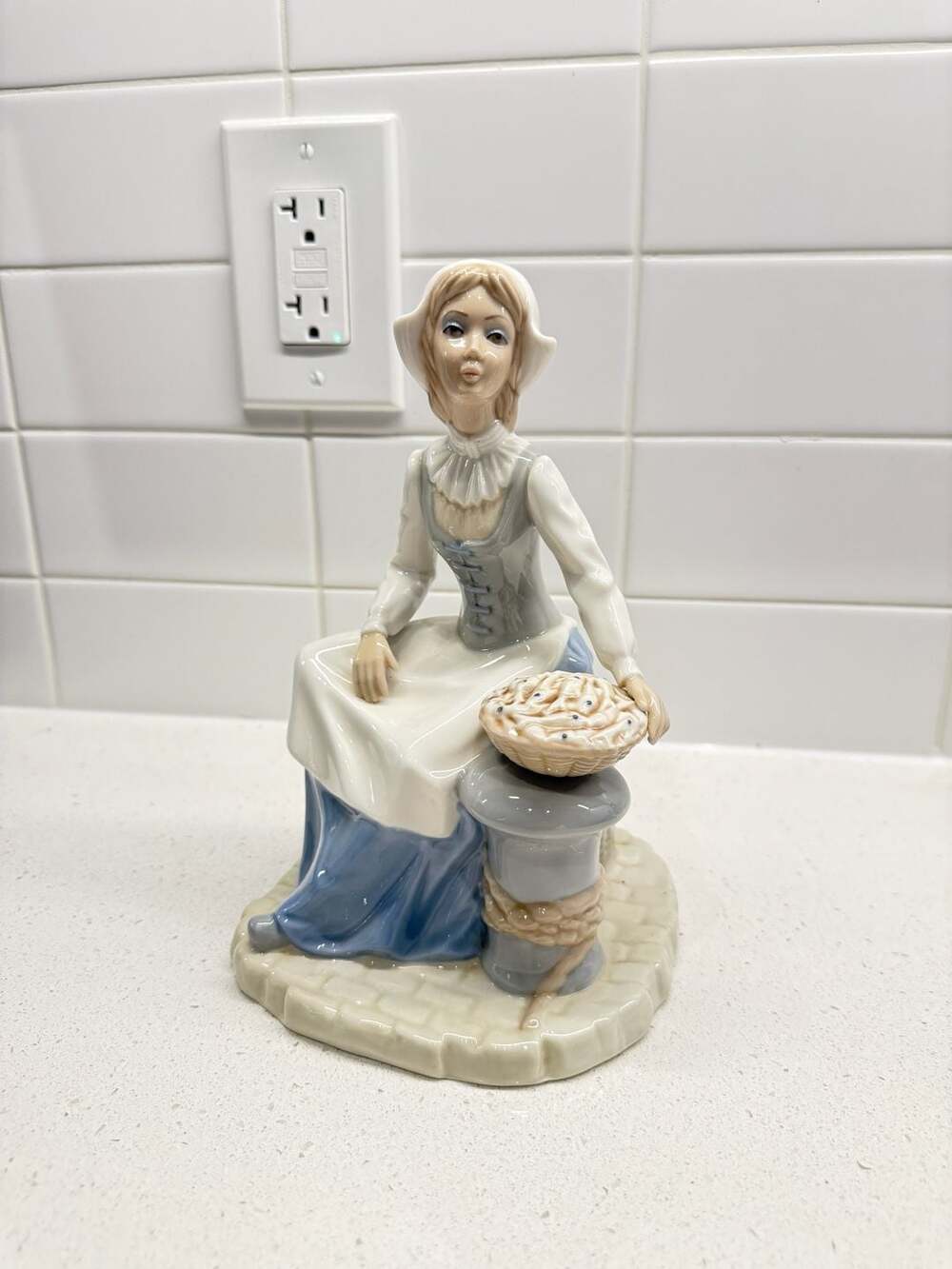 Tengra Porcelain Figurine of Seated Dutch Girl with Basket and Chest